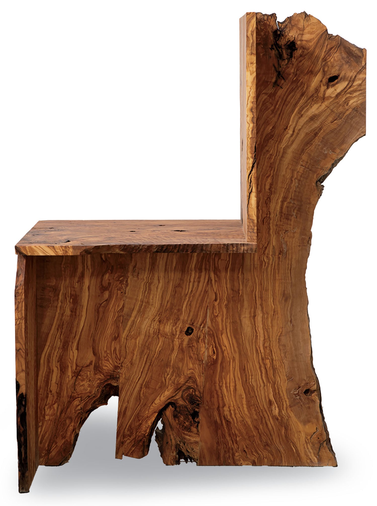 A chair made from a single piece of rustic wood with visible natural grain and rough, uneven edges, resembling a blocky animal shape.