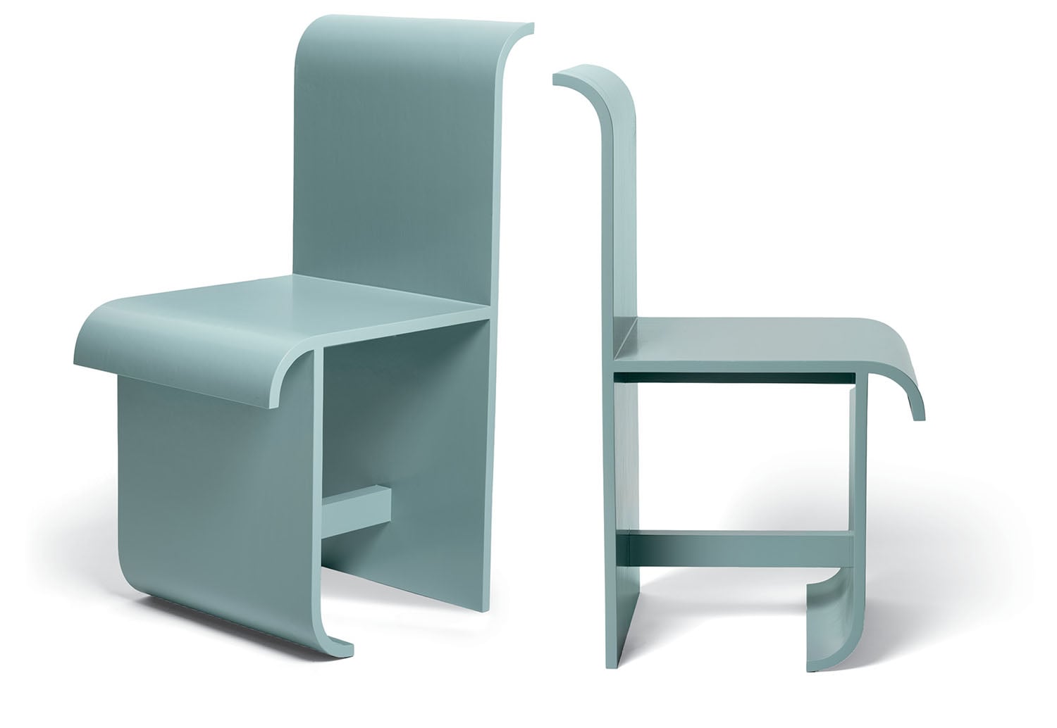 Two modern chairs with a minimalist design, made of light blue material, featuring curved edges and angular lines, shown from front and side views.