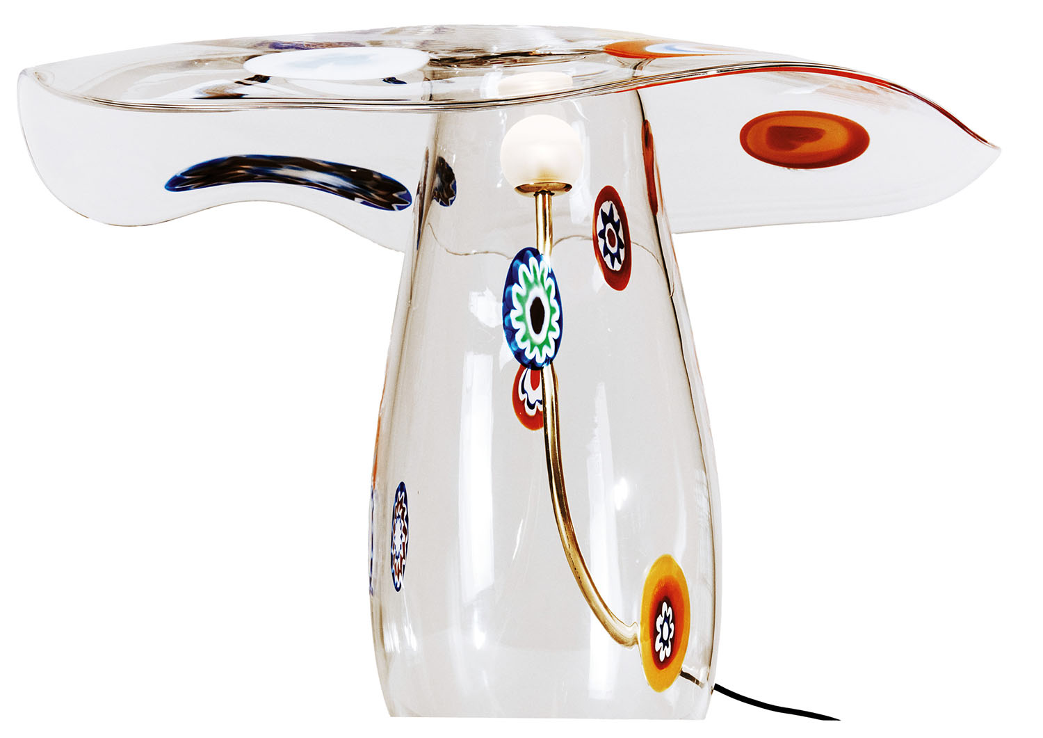 Clear glass table lamp with a wide, irregularly shaped top, decorated with colorful circular patterns and a visible internal light bulb.