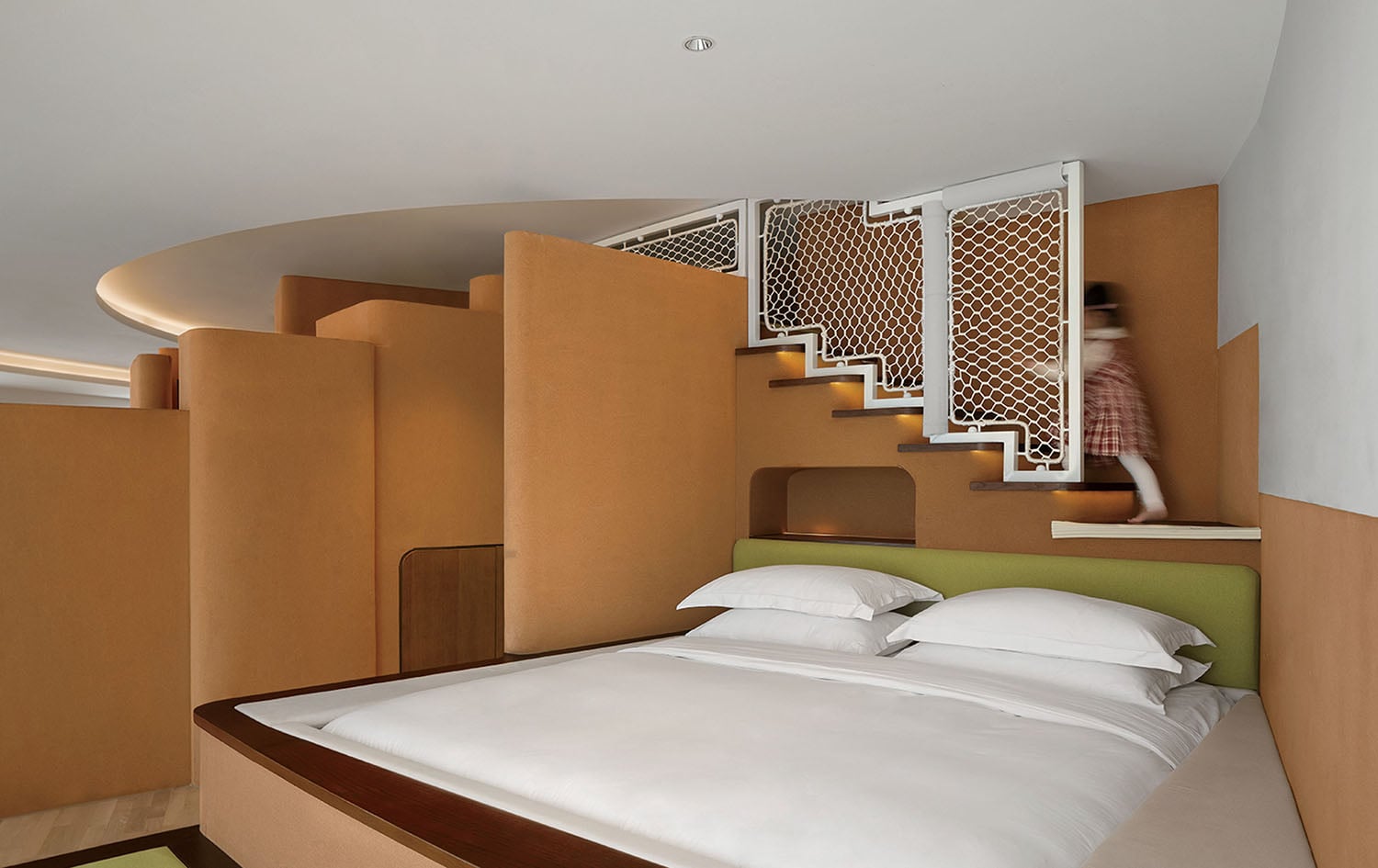 A bed with a white comforter.