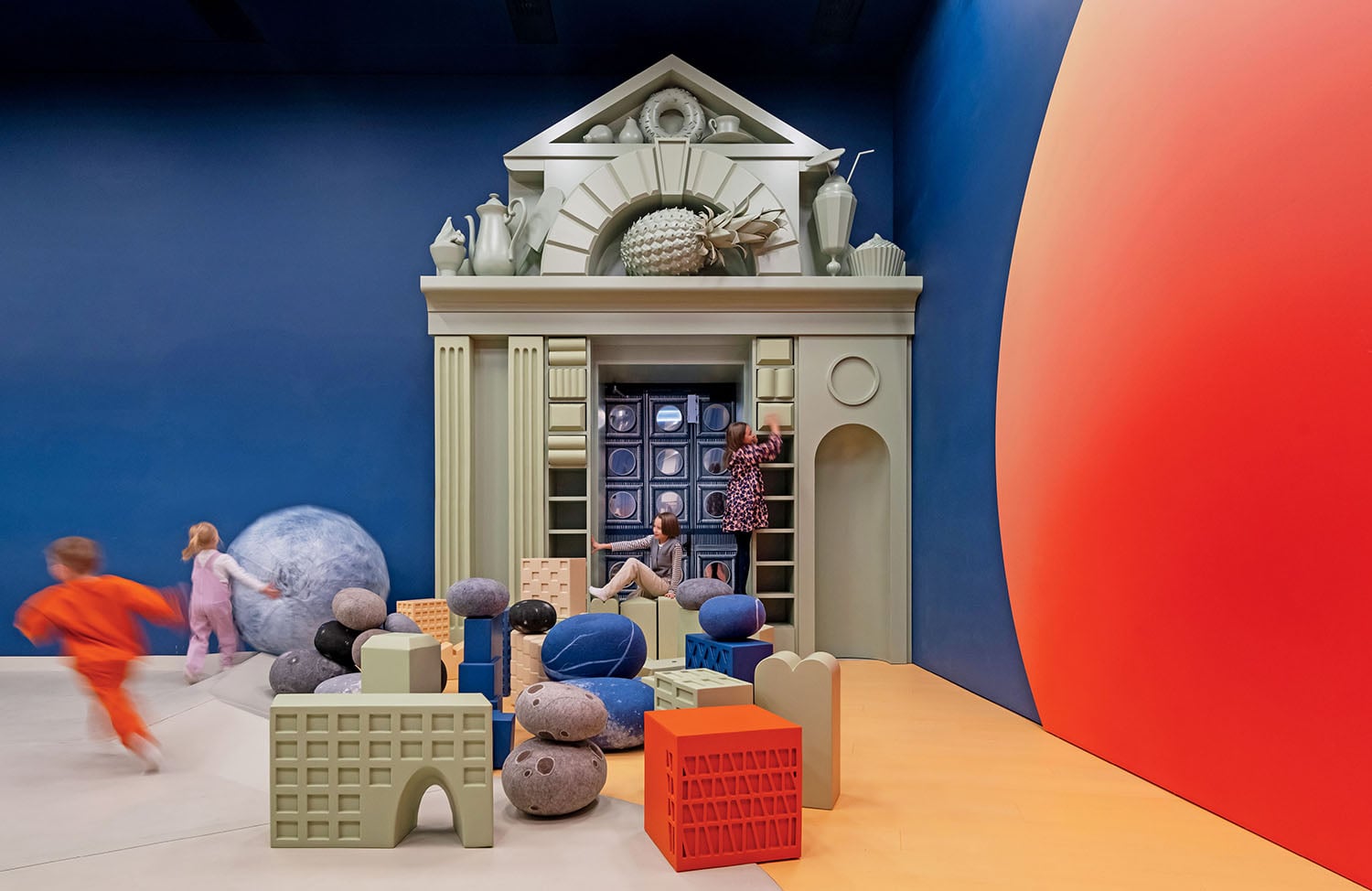 A group of children playing in a room.