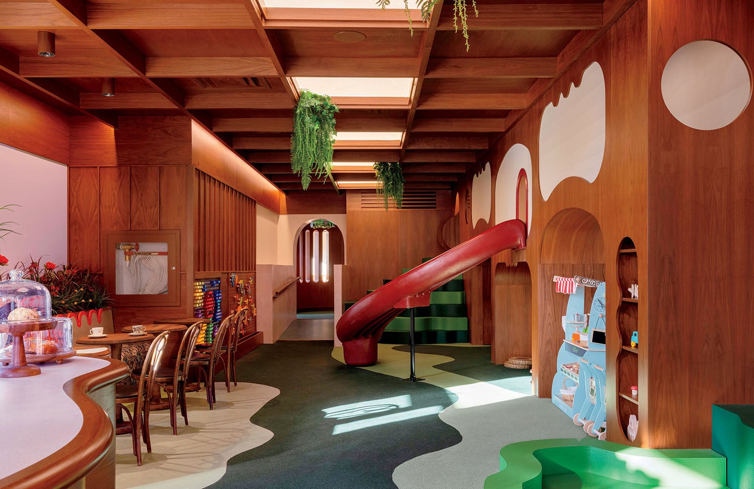 A kid's play room with a slide and a slide.
