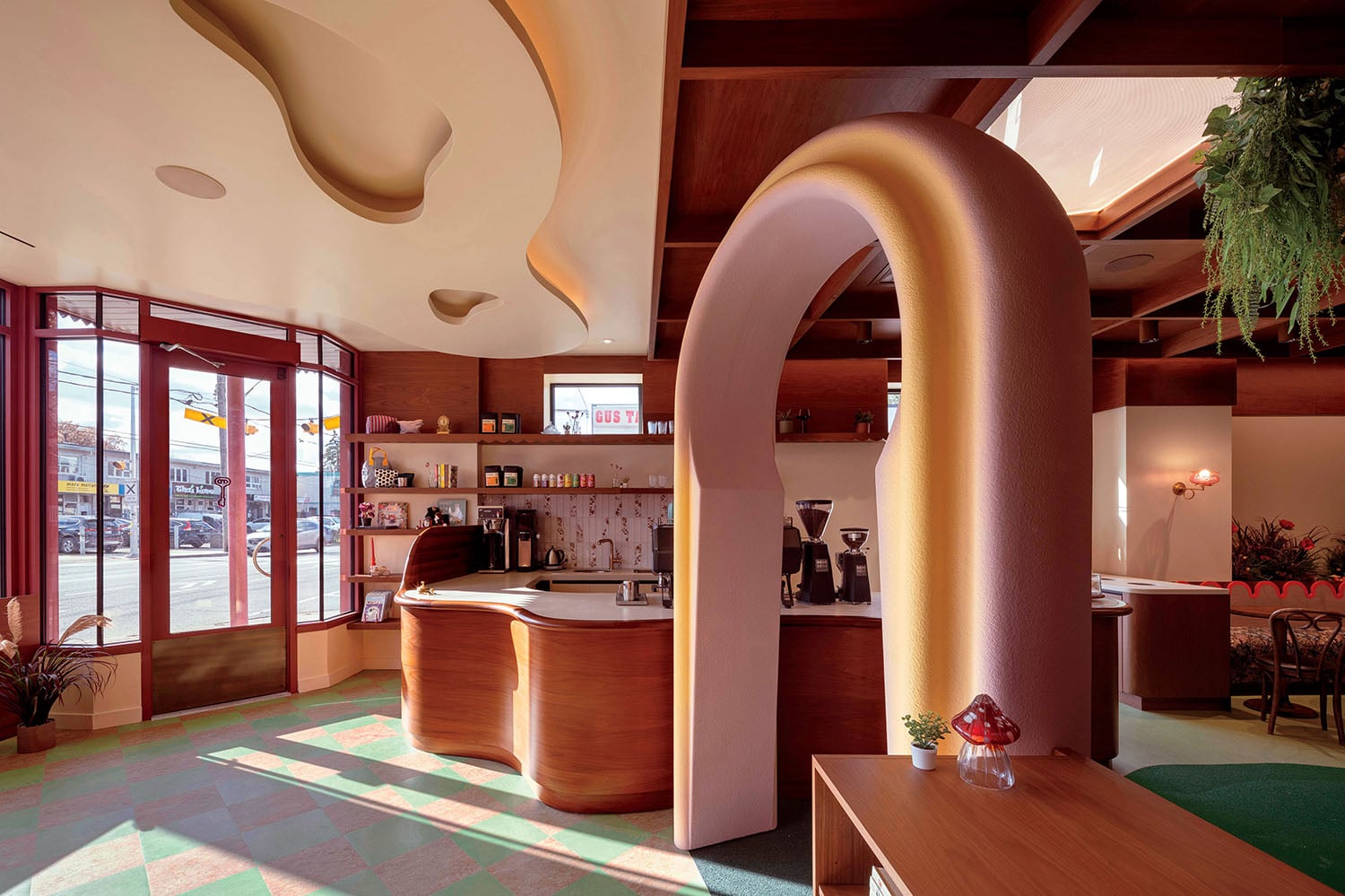 A room with a counter and a bar.