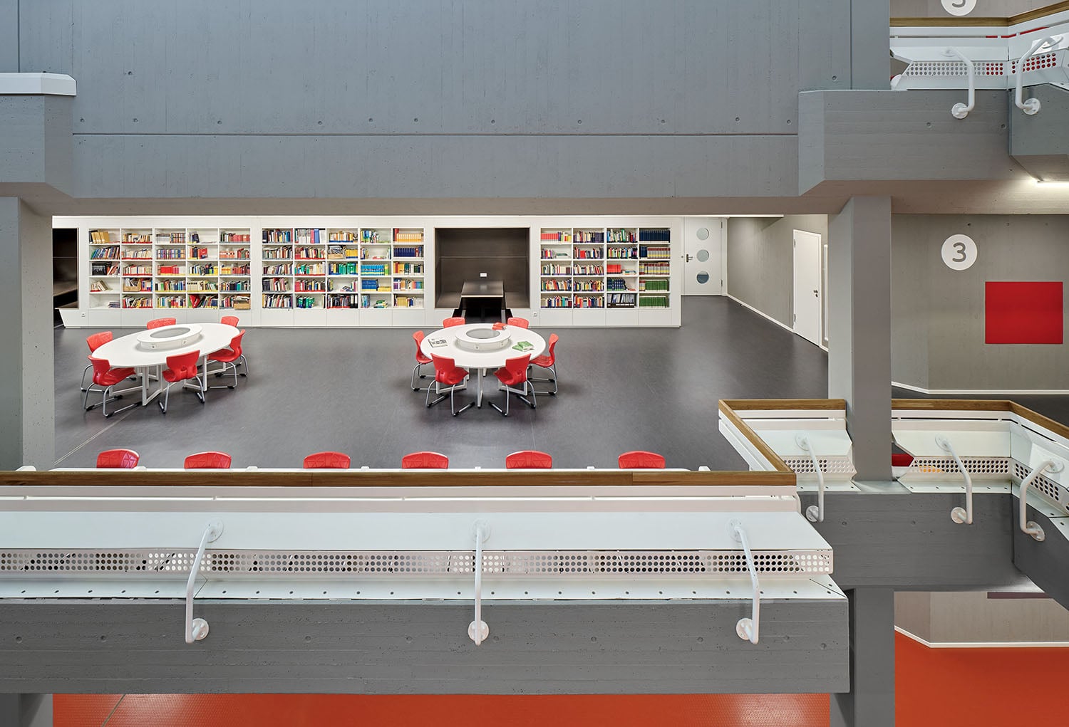 A room with a table and chairs in it.