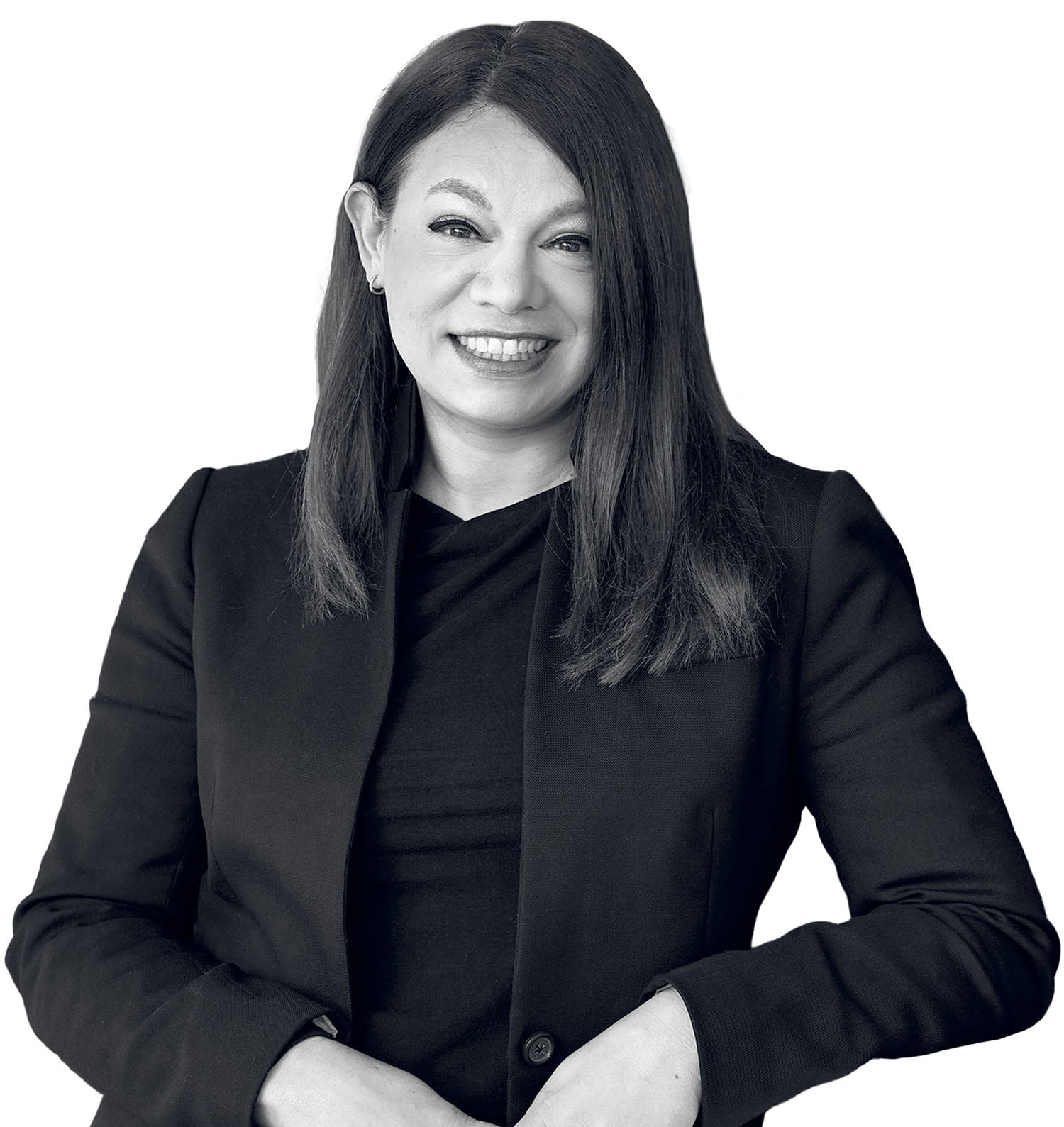 Woman with straight, shoulder-length dark hair, wearing a dark blazer and top, smiling and looking at the camera with hands clasped in front.