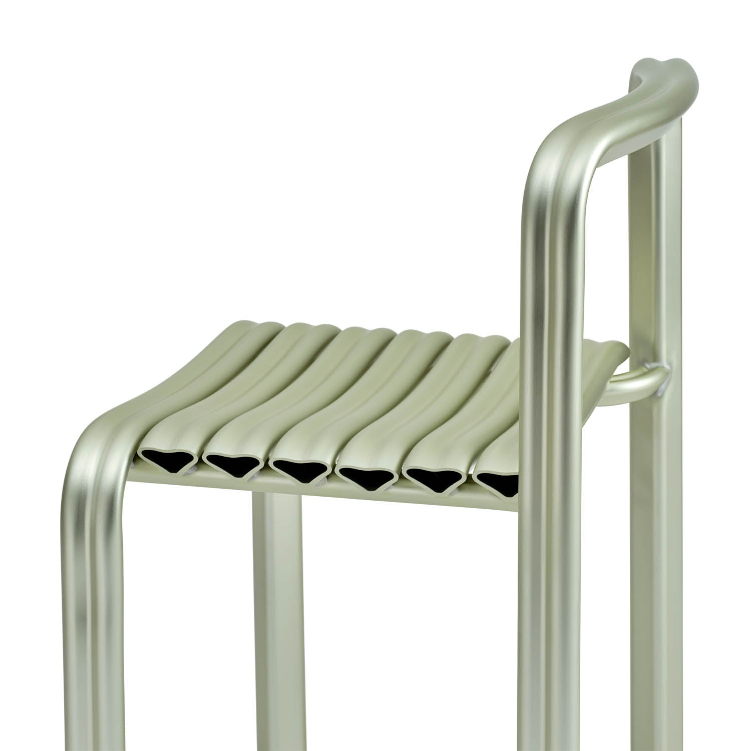 A modern metal stool with a ribbed, tubular seat and curved backrest, featuring an industrial design in a silvery finish.