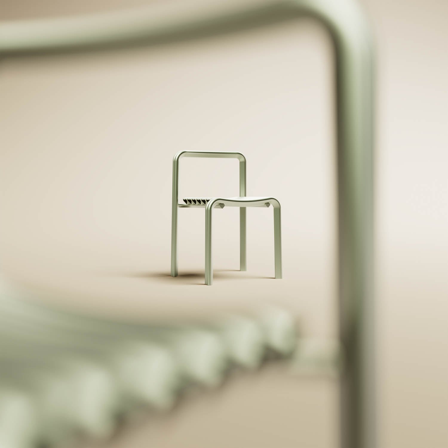A minimalist metal chair is positioned in the center, with part of another similar chair blurred in the foreground. The background is a plain beige.