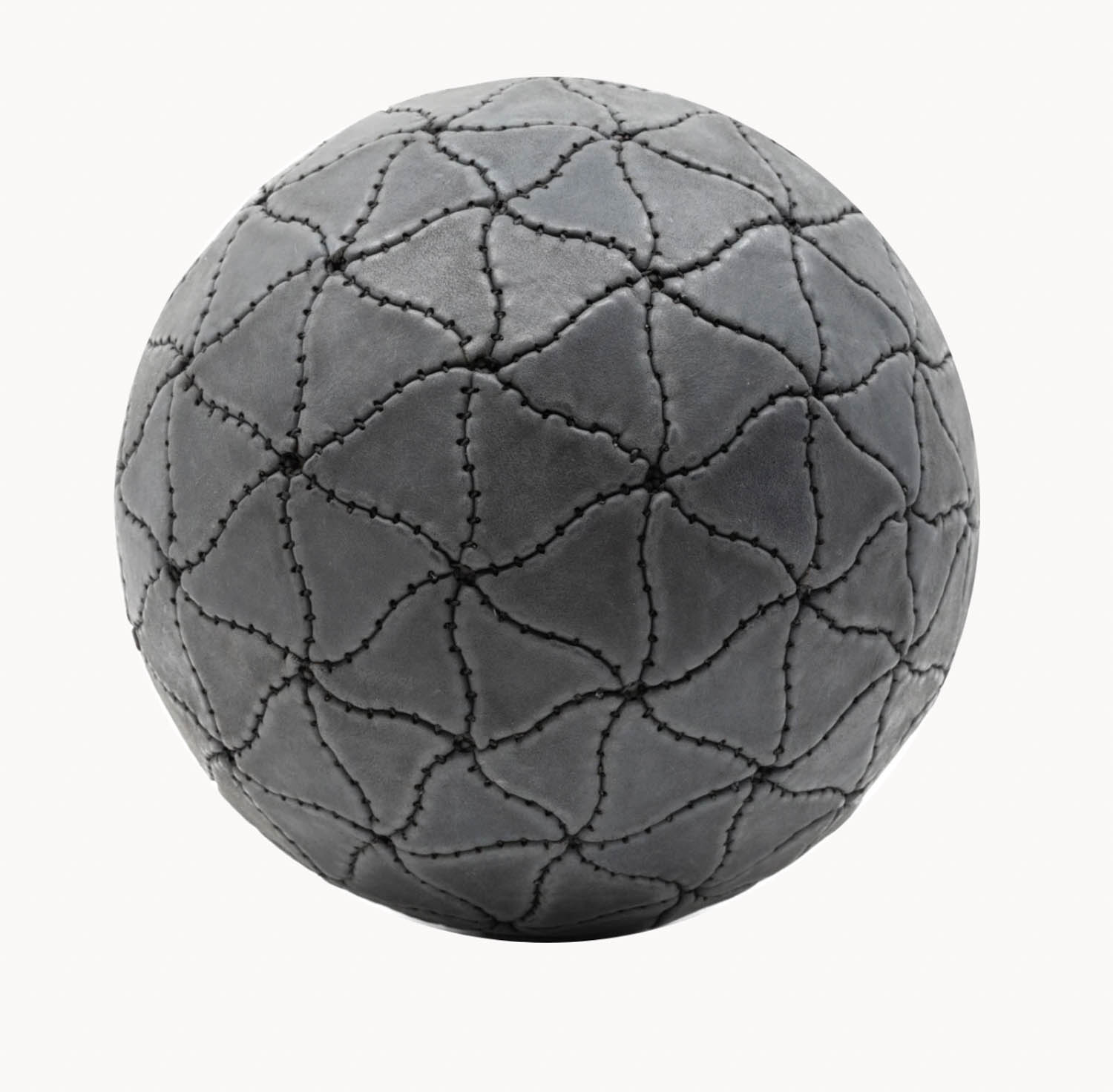 A gray spherical object with an interlocking, curved stitched pattern covering its surface, resembling a textured leather material.