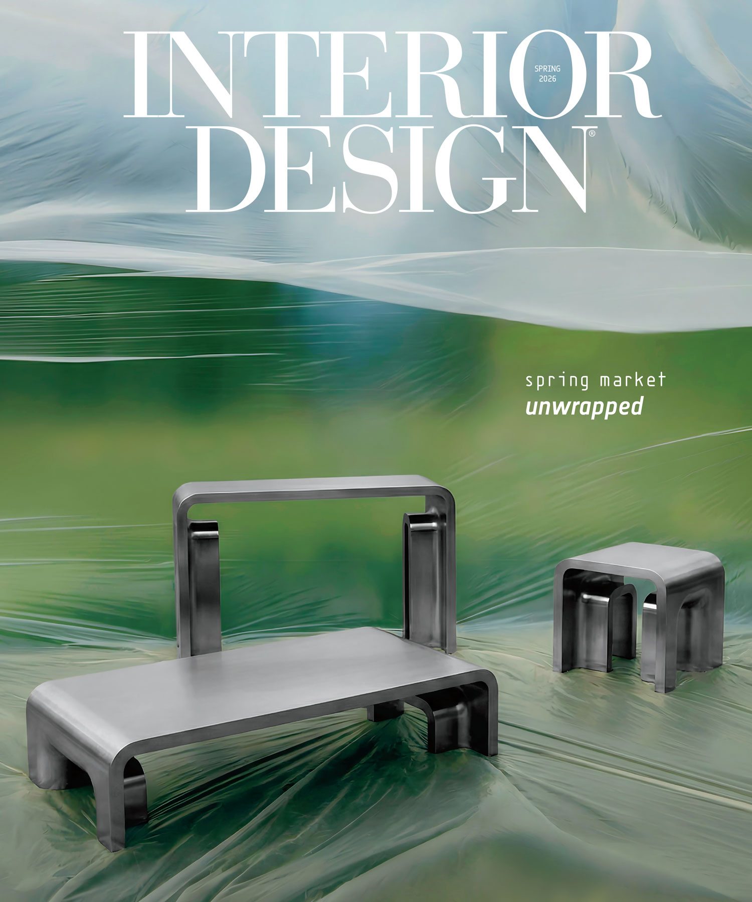Two modern metallic benches are displayed outdoors on grass, with a semi-transparent plastic sheet backdrop. The text "INTERIOR DESIGN" and "spring market unwrapped" is overlaid at the top.