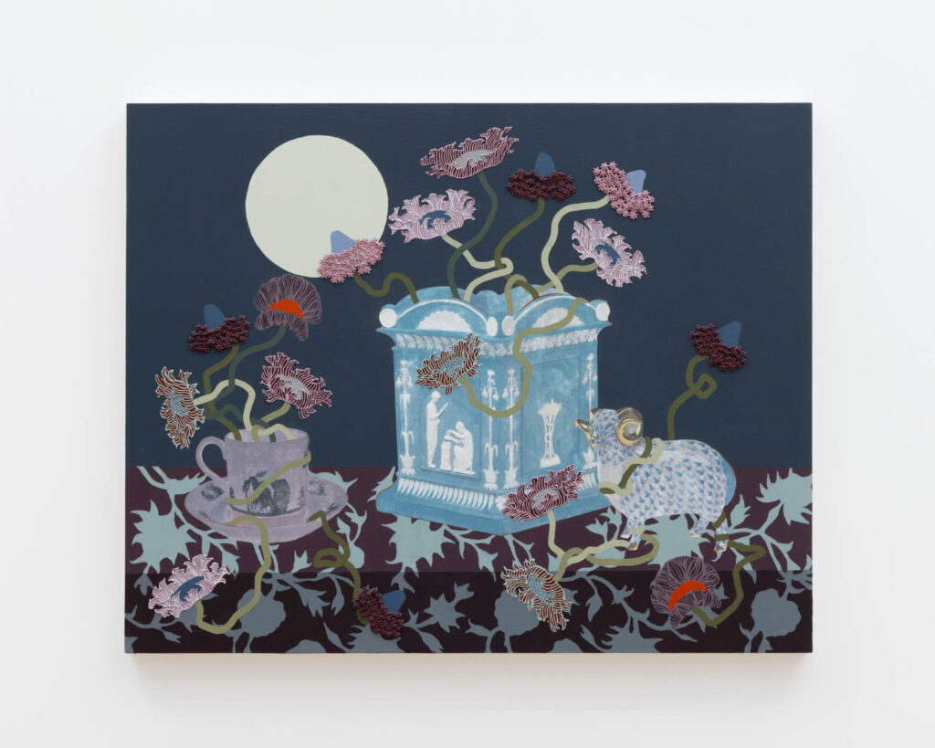A painting of a blue ornate box, teacup, and animal figure on a dark surface with vines, flowers, and a large white circle against a dark background.