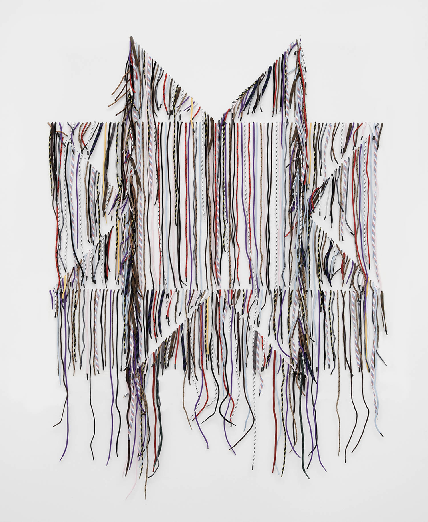 A star outline made with horizontal white strings, overlaid by hanging strands of thread in various colors, displayed against a plain white background.