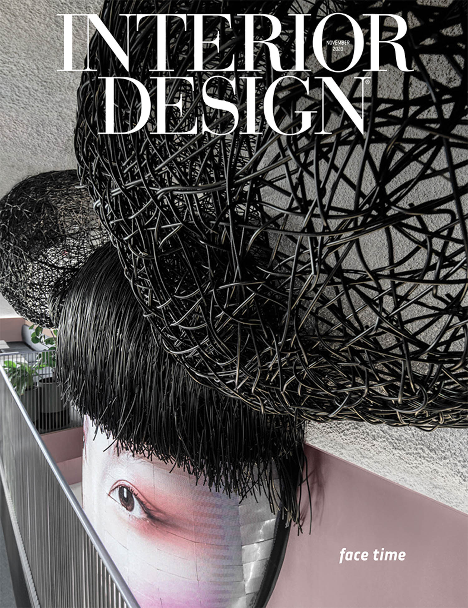 The cover of Interior Design magazine features a woven black sculpture above a photo of a person’s eye and brow, with the caption “face time” in the lower right corner.