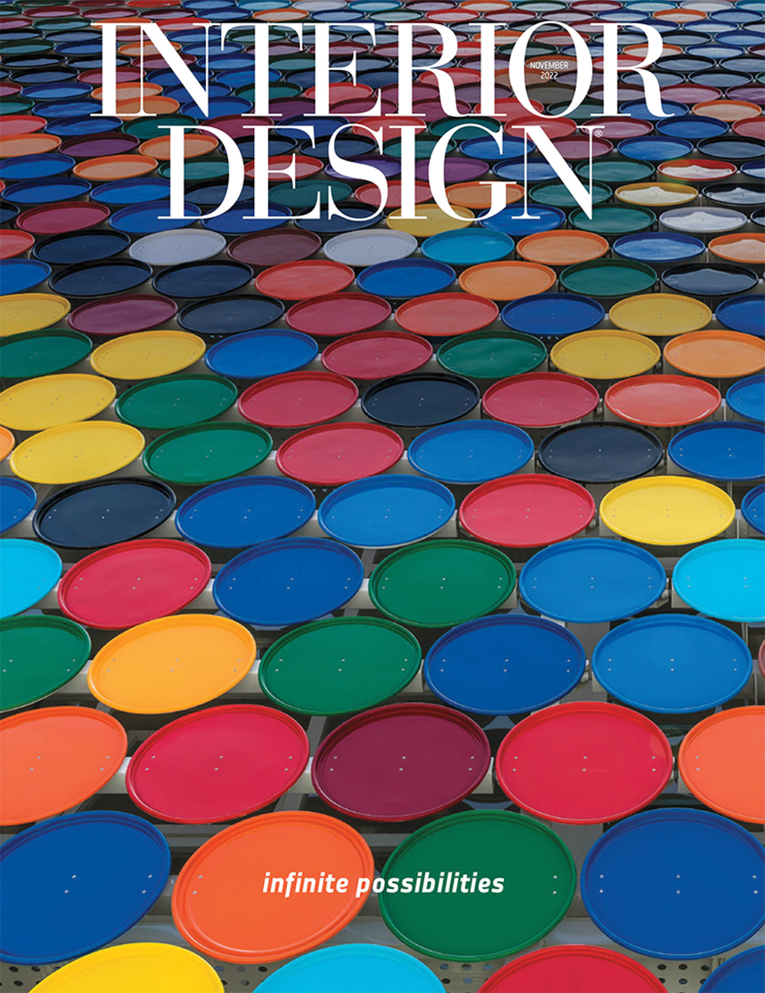 Cover of “Interior Design” magazine featuring a pattern of colorful, closed paint cans arranged in rows; text reads “infinite possibilities.”.