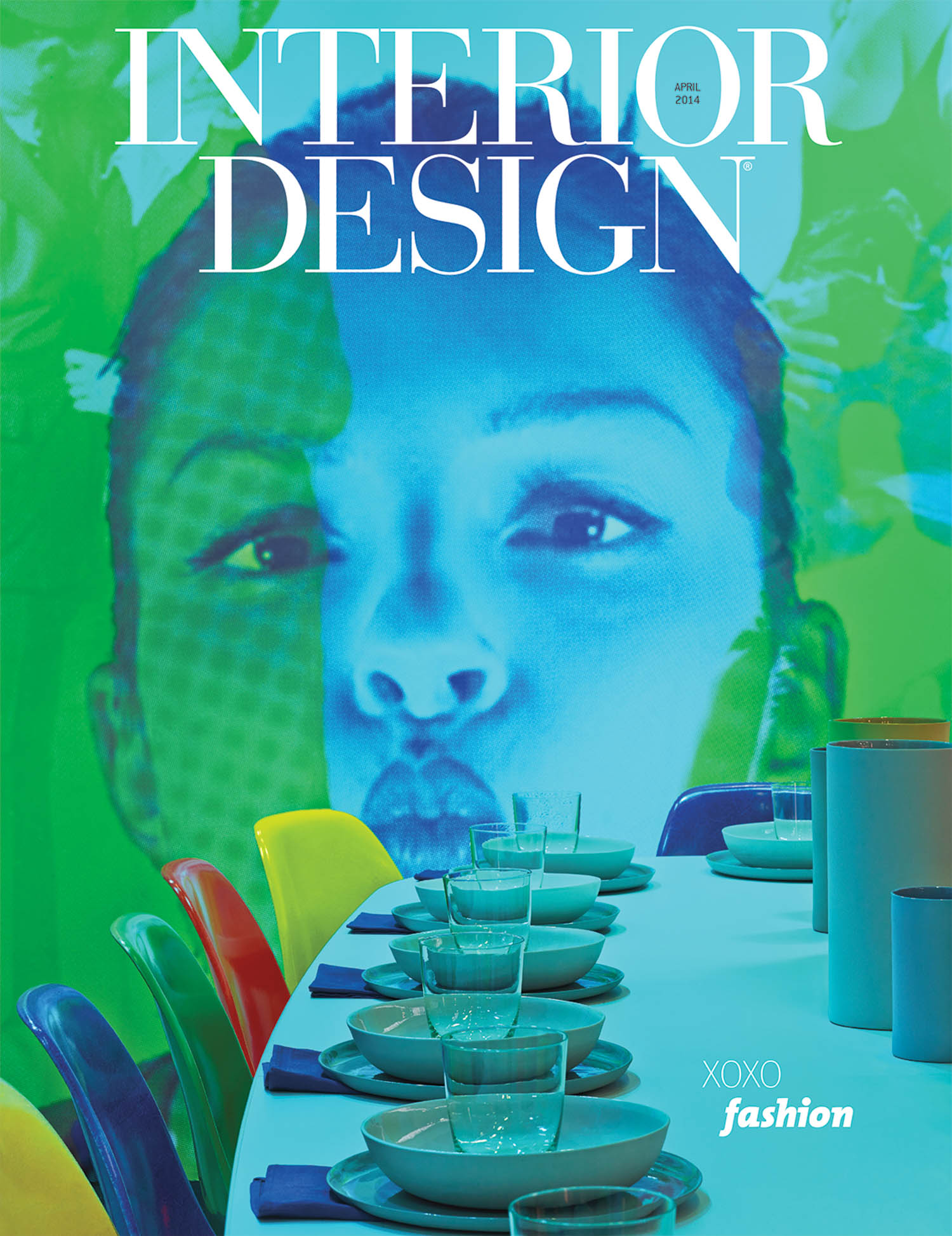Colorful chairs surround a white dining table set with glassware and plates, against a vibrant backdrop featuring a large blue-toned face. The text “INTERIOR DESIGN” appears at the top.