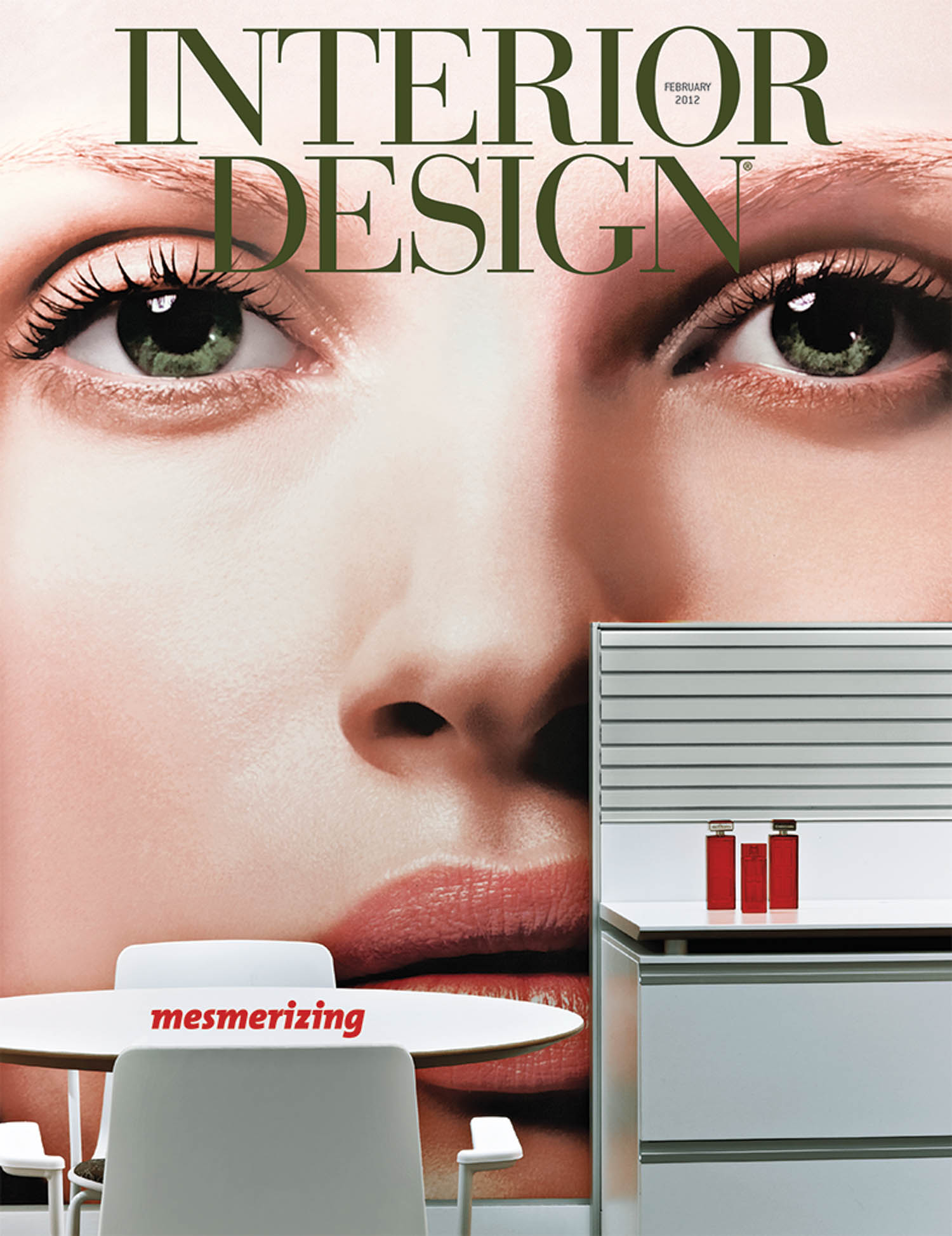 Cover of Interior Design magazine featuring a close-up of a woman’s face behind a modern office scene with a table, chairs, and red bottles. The word “mesmerizing” is on a chair.