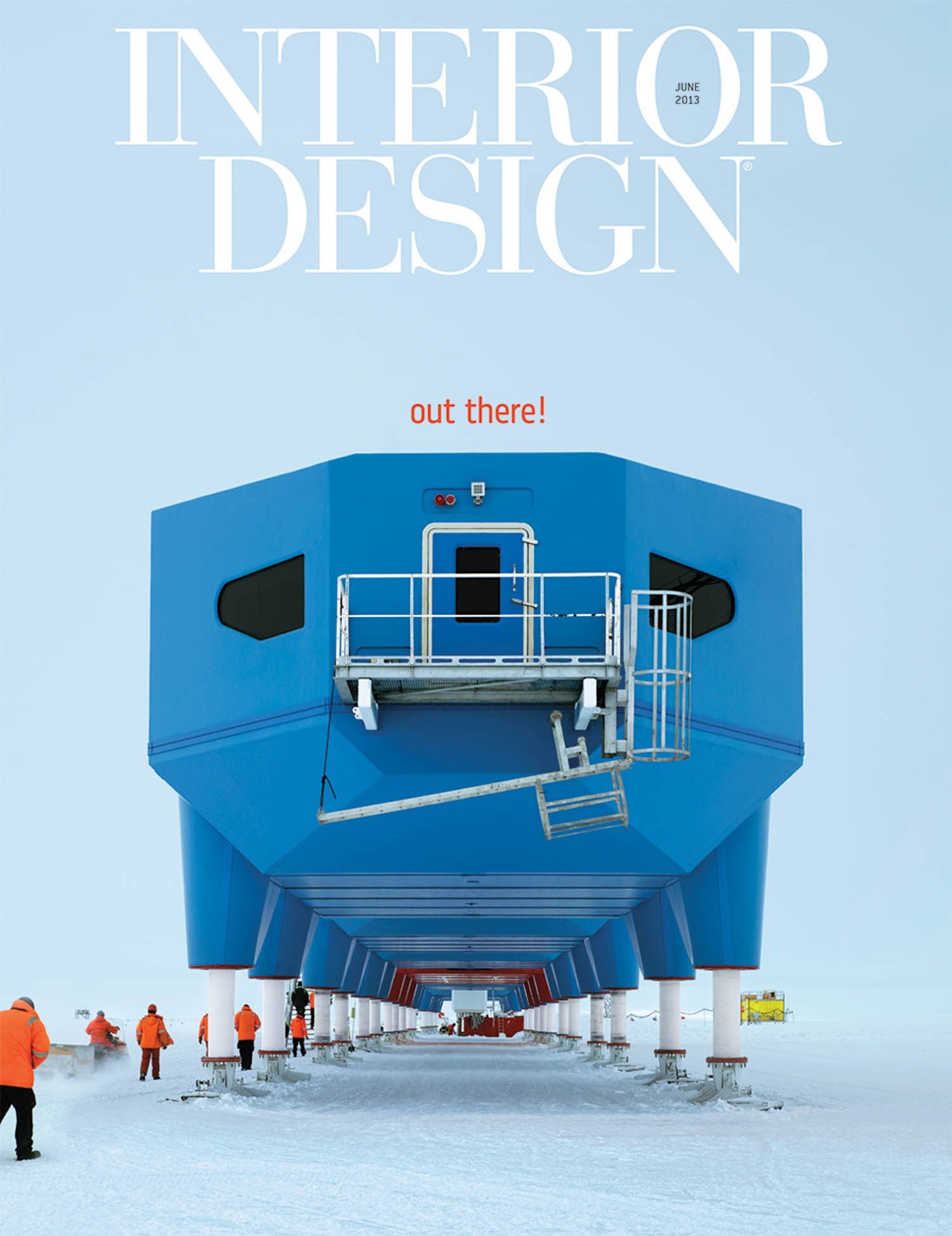Blue modular building on stilts in a snowy landscape, with people in orange jackets walking around; “INTERIOR DESIGN” magazine cover, June 2013, headline reads “out there!”.