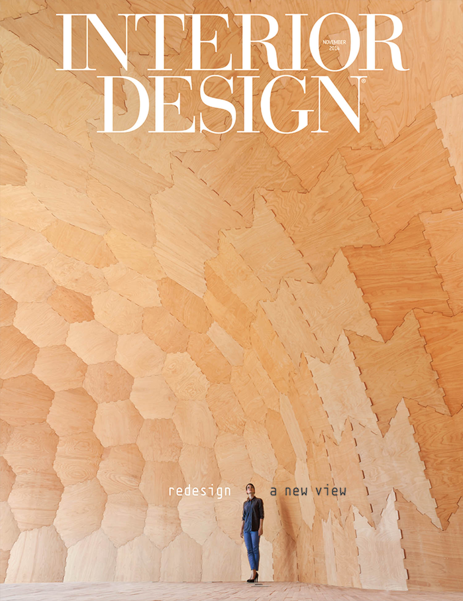 A person stands in a large, geometric wooden interior with a high ceiling; the words “INTERIOR DESIGN” are overlaid at the top.