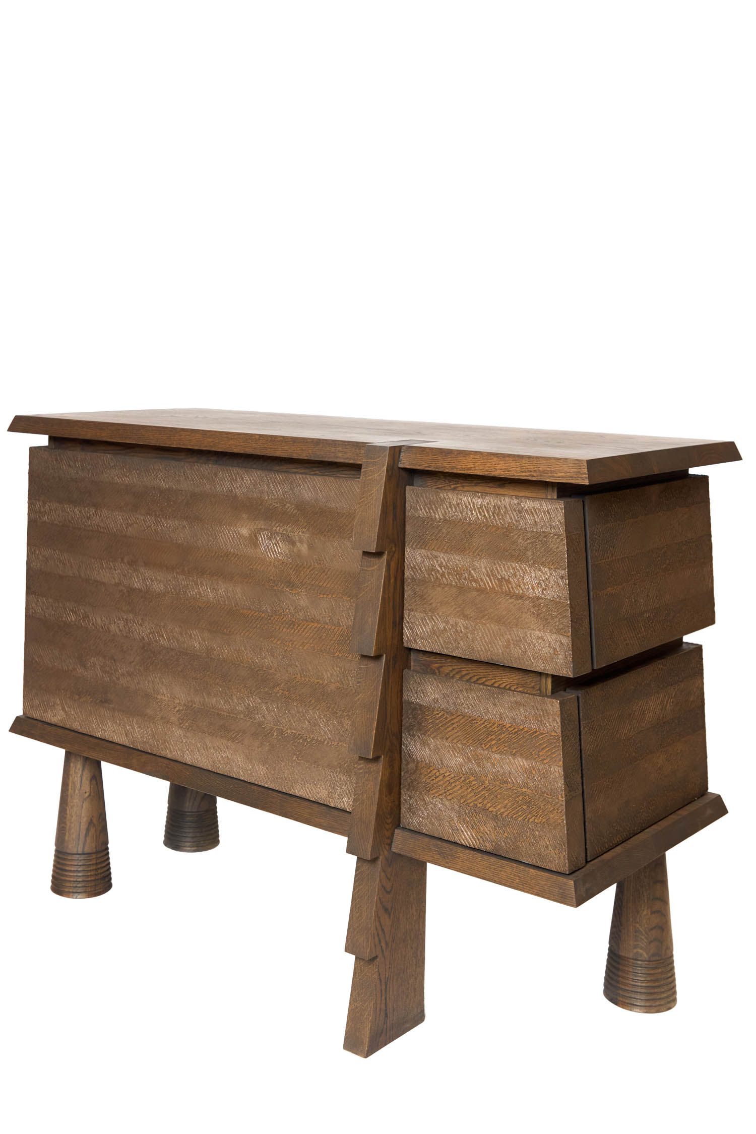 A wooden chest with two drawers on one side, angled legs, and a distinctive asymmetrical design.