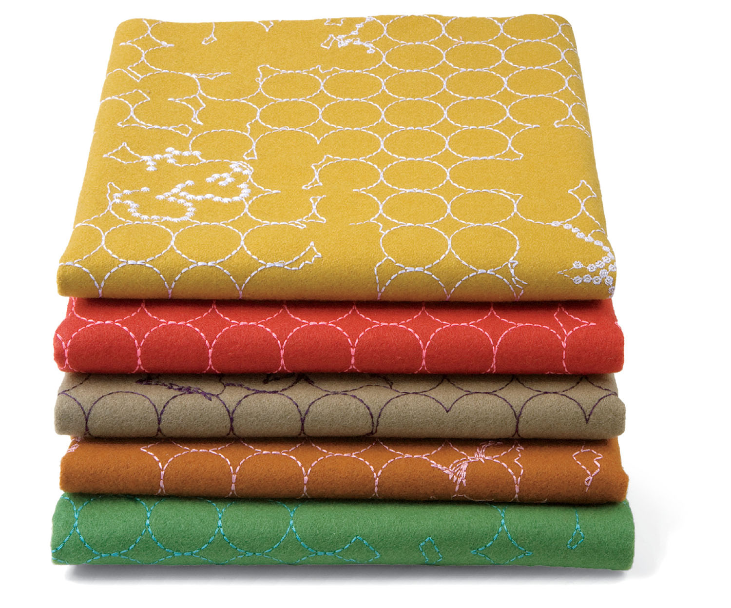A stack of five folded wool blankets in yellow, red, brown, orange, and green, each with a white geometric stitched pattern.