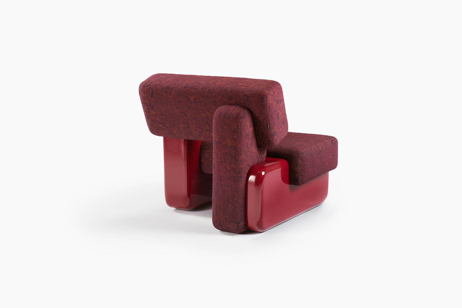Maroon and red modern armchair with geometric design, featuring a fabric-upholstered seat and backrest and glossy red base, placed on a white background.