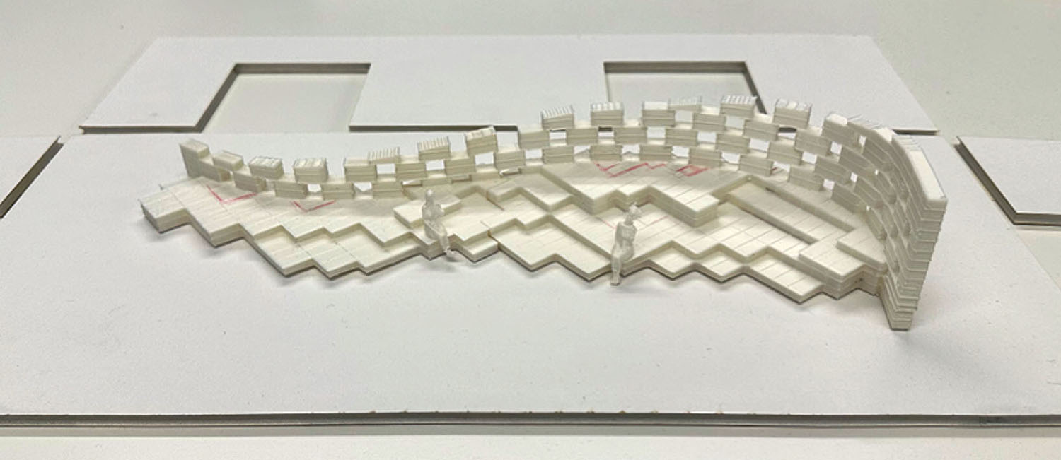 Architectural model of a tiered, curved seating structure with two small figures sitting on the steps.