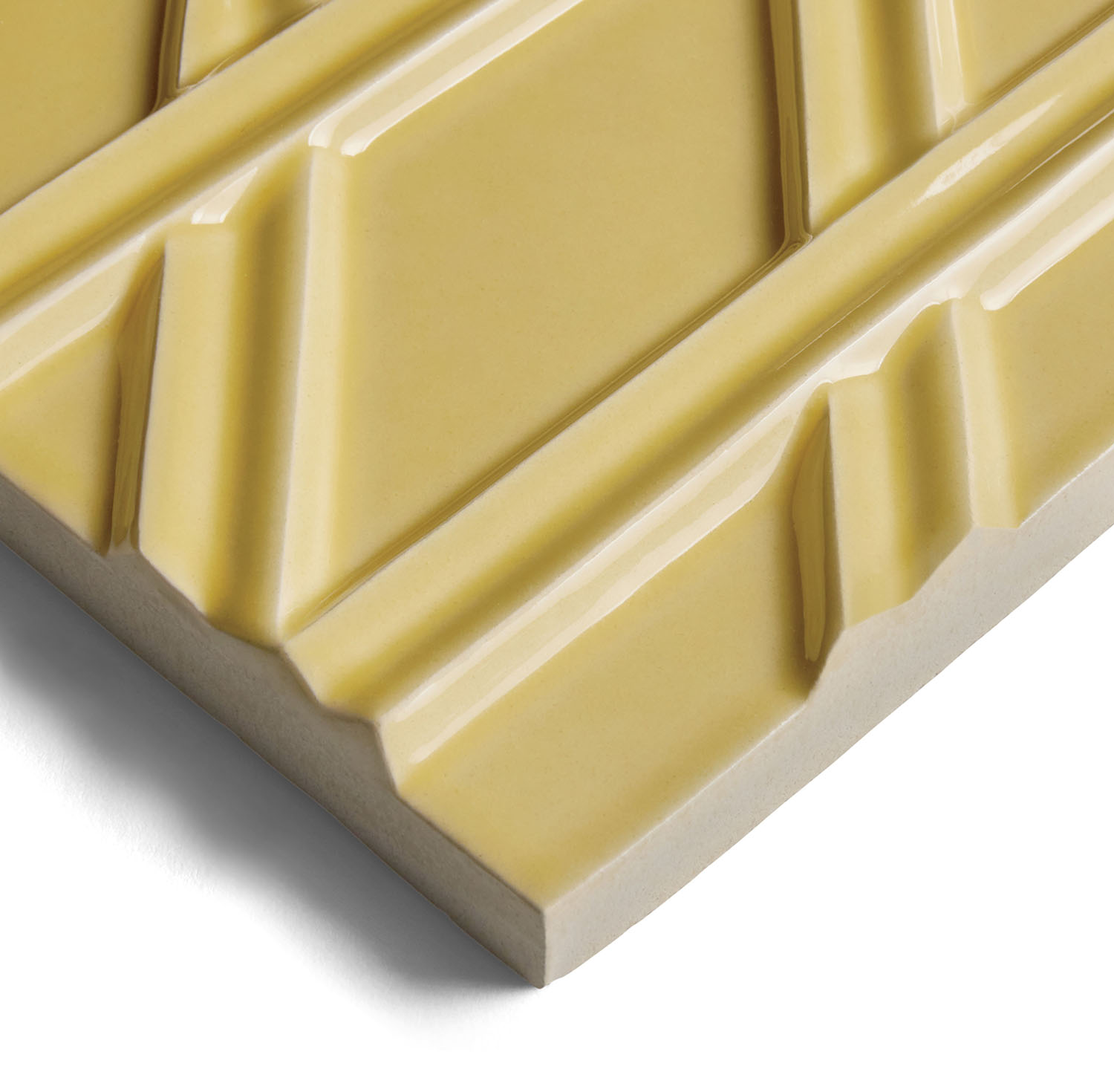 Yellow ceramic tile with a raised geometric crisscross pattern.